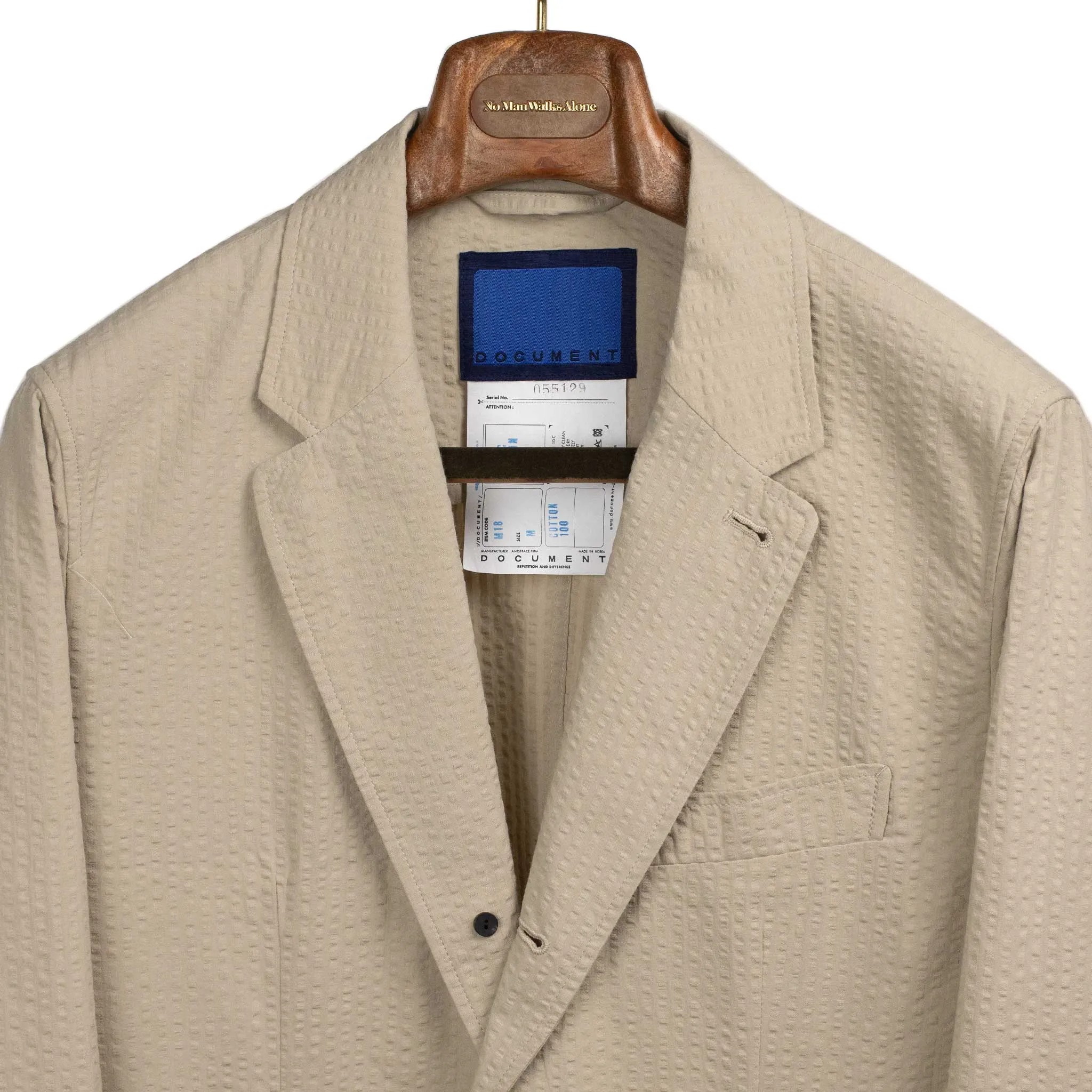 Single breasted jacket in beige cotton seersucker